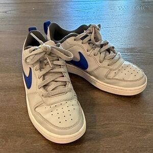 Nike Gray Sneakers with Blue Swoosh